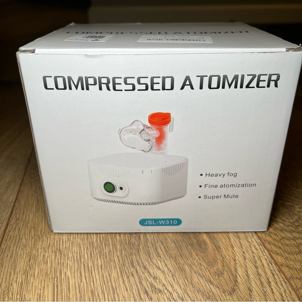 Compressed Atomizer with Orange and White Design